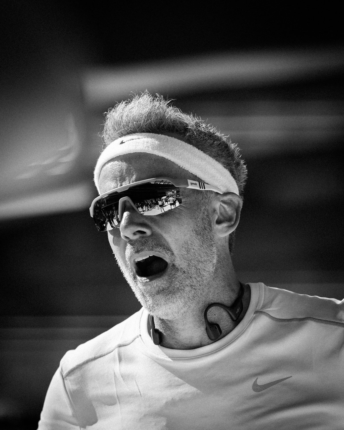 Melbourne Marathon, a runner mid-shout, headband and mirrored shades